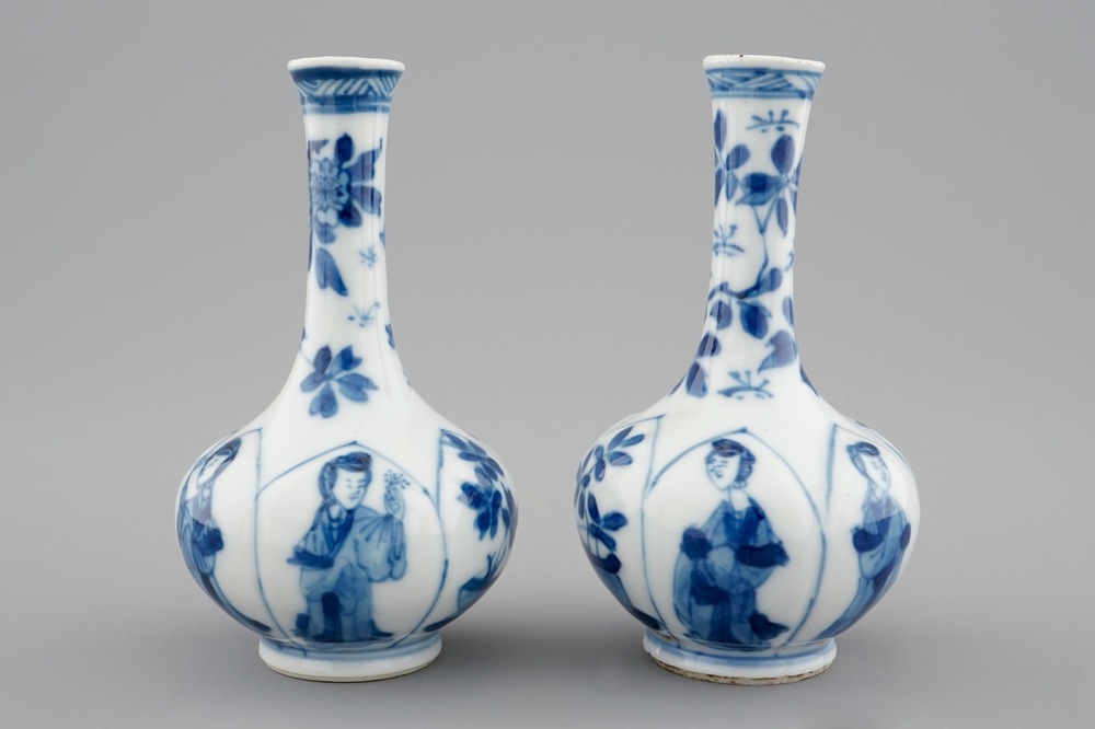 A pair of Chinese blue and white bottle shaped vases with long Elizas, Kangxi
